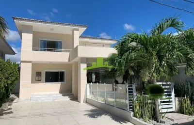 Casa à venda na priscila dutra, lauro de freitas: 5 suítes, piscina, espaço gourmet, 4 vagas e infraestrutura completa. porteira fechada