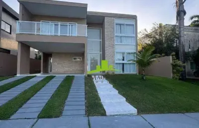 Alphaville litoral norte 1. casa à venda com 290m², 4 suítes, piscina privativa, nascente total, espaço gourmet, acabamento premium. alto padrão.