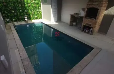 Casa geminada com piscina, 2 dormitórios churrasqueira e 3 vagas no bairro mirim