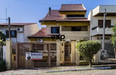 Casa com 4 quartos à venda na avenida pereira pinto, 215, jardim são pedro, porto alegre por r$ 1.185.000