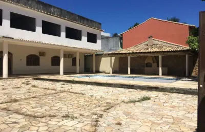 Terreno de 750 m2 com casa inacabada, 13 quartos, braga, cabo frio, rj