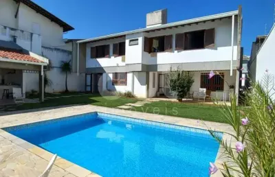 Casa em condomínio fechado com 4 quartos para alugar na rua pedro nacib jorge, 3, jardim das paineiras, campinas, 398 m2 por r$ 11.700