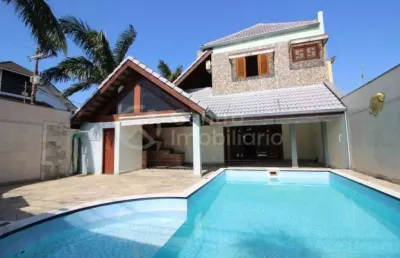 Casa à venda com piscina e 4 quartos em peruíbe, no bairro centro