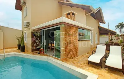 Casa à venda com piscina e 3 quartos em peruíbe, no bairro estancia sao jose