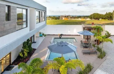 Casa em condomínio com 3 dormitórios, sala para 2 ambientes, cozinha americana e varanda à venda, 112 m² por r$ 615.000 - enseada de jacumã - conde/pb