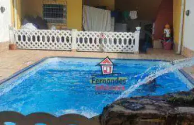 Casa térrea com piscina mais edícula , com 2 dormitórios à venda, 129 m² por r$ 720.000 - caiçara - praia grande/sp