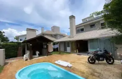 Casa em condomínio fechado com 4 quartos à venda na avenida interbalneários, 436, atlântida, xangri-lá por r$ 3.000.000
