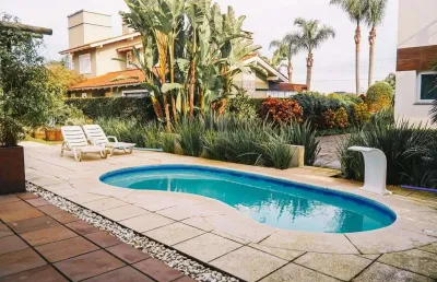Casa em condomínio fechado com 5 quartos à venda na avenida inter balneários, 436, atlântida, xangri-lá por r$ 3.500