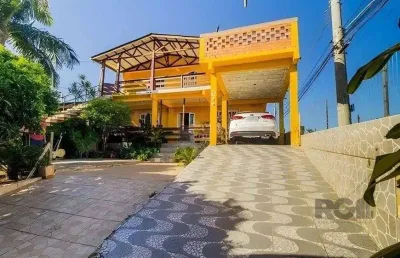 Casa de 4 dormitórios,  no bairro lomba do pinheiro