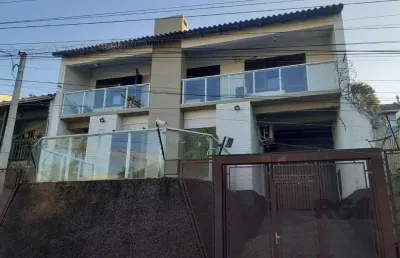 Casa com 3 quartos à venda na Rua Eurico Lara, 505, Medianeira, Porto Alegre