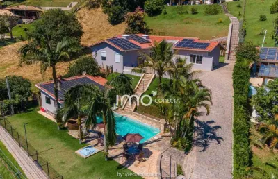 Casa no cond. vale de santa fé com uma vista espetacular conta com 4 suítes , piscina, área gourmet, ampla área verde, e muita segurança! - vinhedo/sp