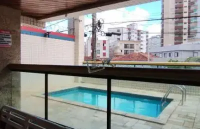 Apartamento com sacada em predio com piscina , caiçara -  praia grande/sp