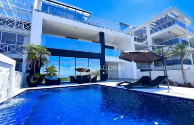 Mansão a beira-mar, com 7 dormitórios à venda, 485 m² por r$ 5.200.000 - brejatuba - guaratuba/pr