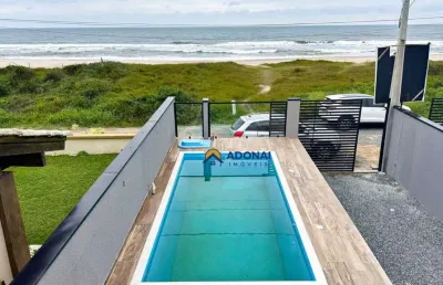 Sobrado de frente para o mar, com 3 dormitórios à venda, 160 m² por r$ 1.680.000 - brejatuba - guaratuba/pr