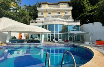 Casa de altíssimo padrão de frente para o mar com 11 suítes, lazer completo e 6 vagas - península, guarujá.