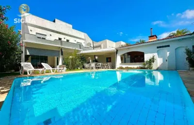 Casa em condomínio fechado com 4 suítes - área de lazer com piscina e churrasqueira - 4 vagas - jardim acapulco - guarujá/sp.