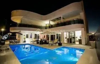 Casa em condomínio fechado com 5 quartos à venda na rua das caraúnas, 463, jurerê internacional, florianópolis, 739 m2 por r$ 12.000.000