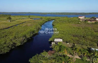 Residência com amplo terreno à beira da lagoa no bairro pinheiros, balneário barra do sul, sc