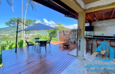 Linda casa com incrível vista para o mar no condomínio alto da praia vermelha em ubatuba sp