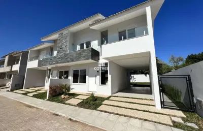 Casa em condomínio fechado com 3 dormitórios, suíte e 2 vagas de garagem