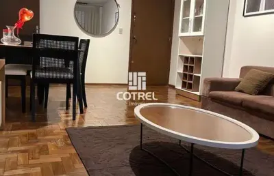 Apartamento mobiliado com 2 dormitórios, suíte, dependência e garagem