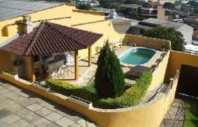 Casa com 4 quartos à venda na Rua Natércia Cunha Veloso, Alto Petrópolis, Porto Alegre