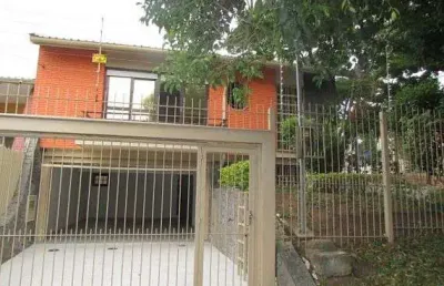 Casa com 4 quartos à venda na Rua Delfino Riet, Santo Antônio, Porto Alegre