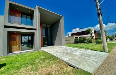 Casa em condomínio fechado com 4 quartos à venda na rua divisa, 32, centro, xangri-lá, 230 m2 por r$ 1.950.000