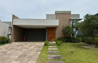 Casa em condomínio fechado com 4 quartos à venda na rua onório germano, 2009, araça, capão da canoa por r$ 1.600.000