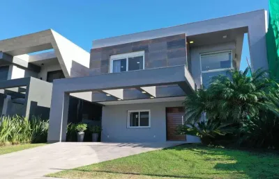 Casa em condomínio fechado com 4 quartos à venda na estrada do mar, 33, parque antártica, capão da canoa, 260 m2 por r$ 2.800.000