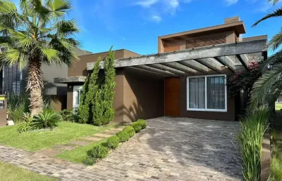 Casa em condomínio fechado com 3 quartos à venda na estrada do mar, 33, parque antártica, capão da canoa por r$ 2.690.000