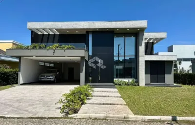 Sobrado com 4 suítes, garagem coberta para 02 carros, em atlântida sul/rs!