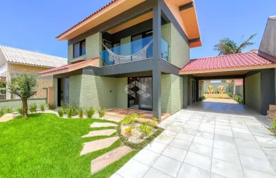 Casa/sobrado 4 dormitórios com garagem para 02 carros em atlântida - xangri-lá/rs