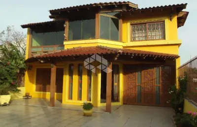 Casa com 4 quartos à venda na Rua Marquês do Maricá, 505, Vila Nova, Porto Alegre