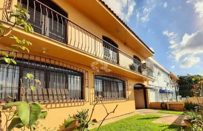 Casa com acessibilidade de 4 dormitórios 4 vagas no partenon