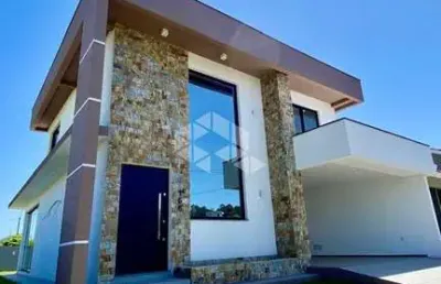 Casa em condomínio fechado à venda em camobi  com 3 suítes