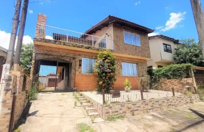 Casa em com 6 dormitórios, 5 vagas de garagem em canoas bairro estância velha.