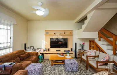 Casa sobrado 3 dormitórios 1 suíte, igara/canoas, lavanderia, churrasqueira, piscina aquecida, 4 vagas garagem, pátio. aceita financiamento.