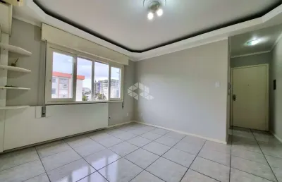 Apartamento com 02 dormitórios, banheiro social, living para 02 ambientes, cozinha, área de serviço, banheiro auxiliar e garagem coberta