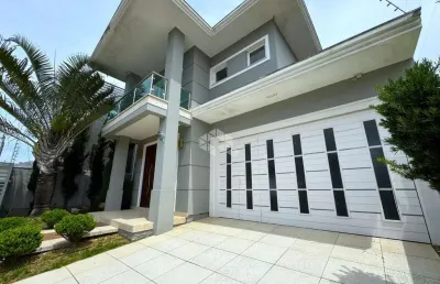 Casa com 3 dormitórios, sendo 3 suítes, 4 vagas, no bairro marechal rondon em canoas - rs.