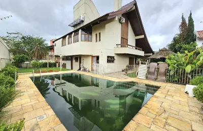 Casa alto padrão, 4 dormitórios, 4 suítes, vaga para 6 veículos no jardim do lago/marechal rondon em canoas.