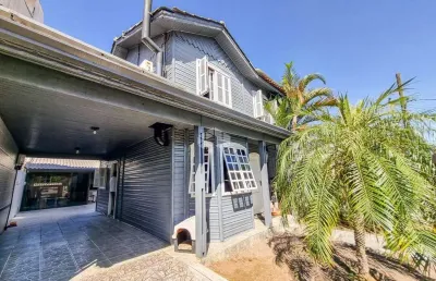 Casa à venda no bairro igara em canoas, 3 dormitórios, salão de festas, piscina e 3 vagas - aceita financiamento e fgts