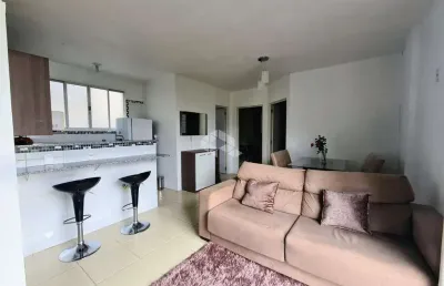Apartamento com 2 dormitórios, 1 banheiro, 1 vaga de garagem, cozinha americana, mobiliado