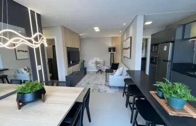 Apartamento com 2 dormitórios (1 suíte), a apenas 1 quadra do mar em capão da canoa.