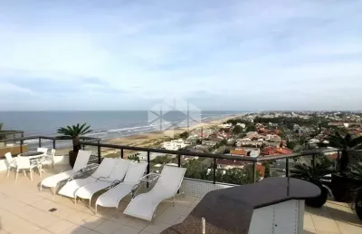 Cobertura 4 dormitórios de frente para o mar em capão da canoa!