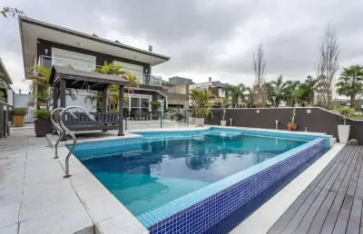 Casa em condomínio com 4 quartos, sendo 4 suítes, 506m², 4 vagas no bairro terra ville porto alegre