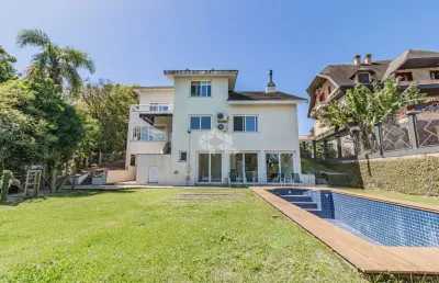 Casa em condomínio fechado com 4 quartos à venda na Avenida Firmino Octávio Bimbi, 255, Cavalhada, Porto Alegre