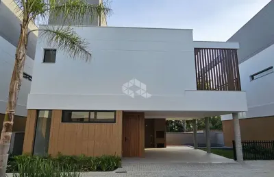 Casa residencial com 3 suítes em condomínio fechado no bairro cacupé, florianópolis-sc