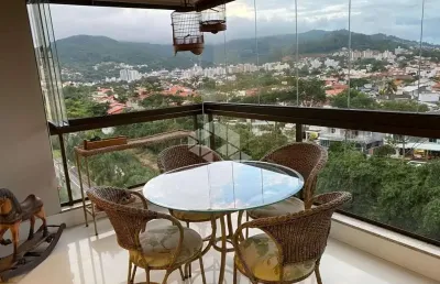 Apartamento semimobiliado com vista panorâmica, 3 dormitórios, sendo 1 suíte, 2 vagas -  itacorubi, fpolis sc