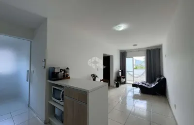 Apartamento semimobiliado com 2 quartos e sacada com churrasqueira em são josé